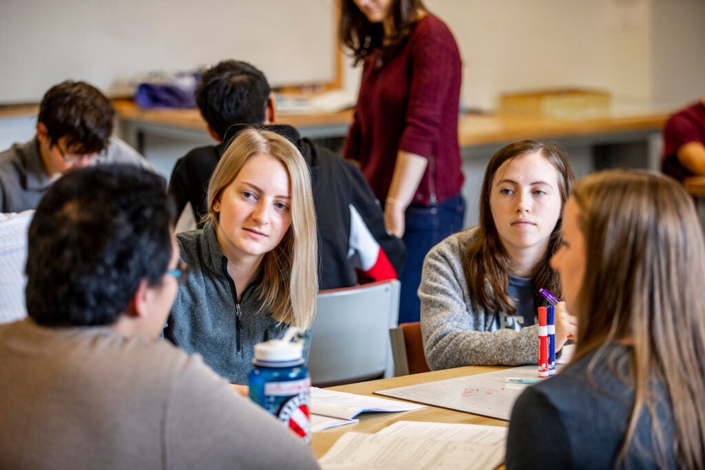 Students studying in conference room.