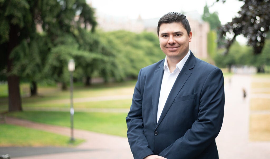 Professional photo of Mike Teodorescu on the University of Washington's campus.