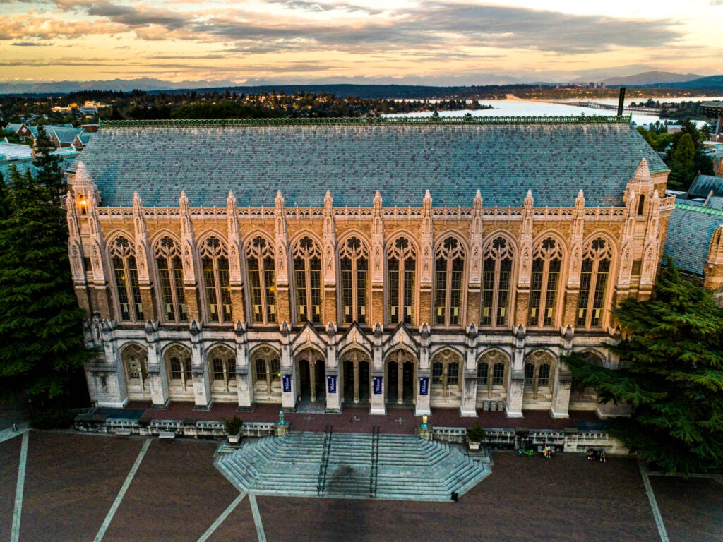 An aerial view of a building on the University of Washington's campus at sunset.